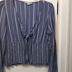 American Eagle top. Above belt buckle length.